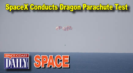 The SpaceX main parachutes control the descent of the Dragon test article following a drop test over the Pacific Ocean, off the coast of Morro Bay, Calif. (NASA.gov image)