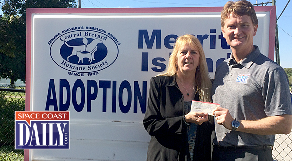 The 2014 Bright House Networks 29th Annual Space Coast State Fair raised funds for the homeless animals at the Central Brevard Humane Society. Above, Space Coast State Fair Committee Chairman Giles Malone presents Central Brevard Humane Society Executive Director Theresa Clifton a check for $5,420.94. (SpaceCoastDaily.com image)