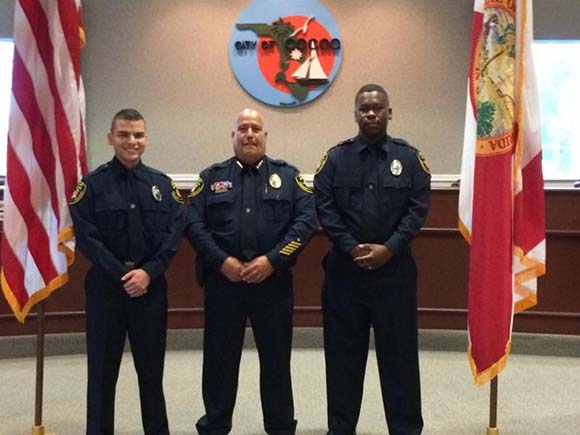 Chief Mike Cantaloupe administered the Oath of Office to two new officers on Monday. Chris Delgado, 22 and Nicholas Hall, 23 accepted the oath before a small crowd of family, friends and police command staff during a brief special ceremony held in the Council Chambers at City Hall. (Image for SpaceCoastDaily.com)