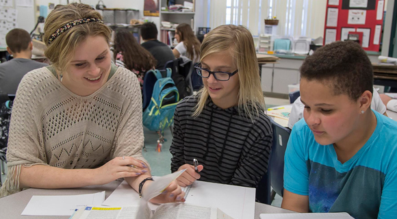 An EFSC student tutors at Sherwood Elementary near the College's Melbourne Campus through a volunteer position coordinated by the Center for Service Learning and Civic Engagement. (Image for Space Coast Daily)