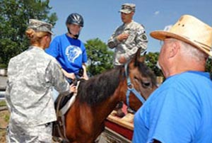 Sanctuary Island coordinates participation in equine-related activities and therapeutic programs created specifically to support wounded and/or health-challenged war veterans, their immediate family members who also may need therapeutic assistance, and children who are disabled and/or facing adversity. (SanctuaryIsland.org image)