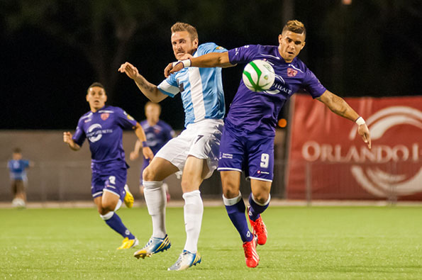 Dom Dwyer powers past a Wilmington defender on his way to a single season scoring record (Image Credit: Michael Moore II)