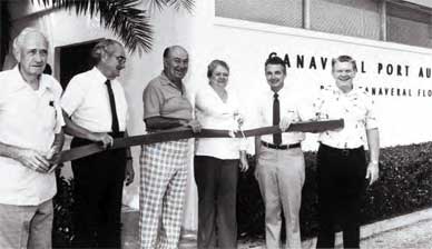 Ribbon cutting for a new wing of the Port Authority office: Left to right – Commissioners W. O. B. Clendinen, R. A. Cutter, D. A. “Dave” Nisbet; Executive Secretary Barbara Smith; Executive Director Charles “Chuck” Rowland; and Commissioner M. M. “Buck” Buchanan. (Port Canaveral image)