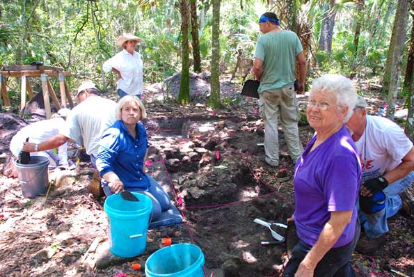 Archaeologist Dot Moore (in purple shirt) and historian Roz Foster (in hat) work with volunteers to excavate the ruins of an 18th century English sugar plantation on the site where Space Florida wants to build a commercial spaceport. (National Park Service image)