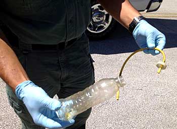 The suspicious items discovered this morning in the vicinity of Jetty Park at Port Canaveral by volunteer beach clean-up crews may be meth-lab equipment and chemicals, according to BCSO.(SpaceCoastDaily.com image)