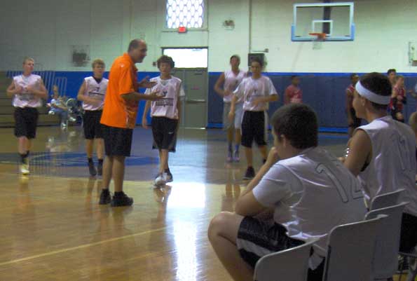 Coach Bob Bumgardner gives his team some pointers during their game on Saturday at the YMCA in Cocoa. (Image for SpaceCoastDaily.com)