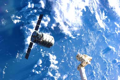 The Cygnus cargo spacecraft is just a few feet away from the International Space Station's Canadarm2. (NASA image)