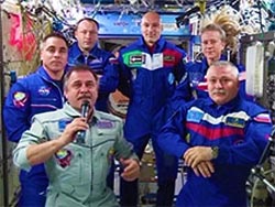 Expedition 36 Commander Pavel Vinogradov (front left) hands over station control to Expedition 37 Commander Fyodor Yurchikhin (front right) in a traditional Change of Command Ceremony Monday afternoon. (NASA.gov image)
