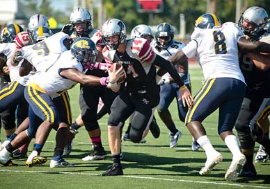 Sean Ashley finds a hole for one of his three touchdowns in Florida Tech's first Homecoming Game on Saturday against Warner University. (Amanda Stratford image)