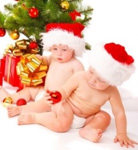 Two Christmas babies playing, isolated