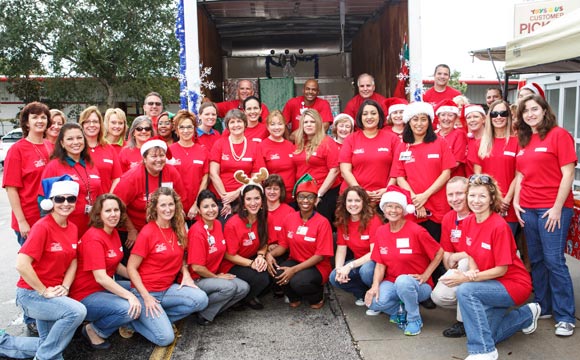 Through the Health First Community Benefits Program, Health First associates and volunteers from the Sharing Center went shopping at the Toys"R"Us in Melbourne to purchase gifts for the "Children Without Christmas Toy Drive." (Image for Space CoastDaily.com)