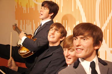 The Beetles gained popularity in the United Kingdom after their first hit, "Love Me Do", in late 1962. They acquired the nickname the "Fab Four" as Beatlemania grew in Britain over the following year, and by early 1964 they had become international stars, leading the "British Invasion" of the United States pop market. (Shutterstock image)