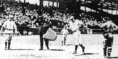 RED KRESS of the Browns touches home plate after blasting a two-run homer into the left field bleachers of Sportsman's Park against the Cleveland Indians on Aug. 2, 1931. Batboy Jimmy Palermo looks on with the Browns' Lin Storti, left, and Indians' catcher Luke Sewell. This photo appeared the next day in the St. Louis Globe Democrat.