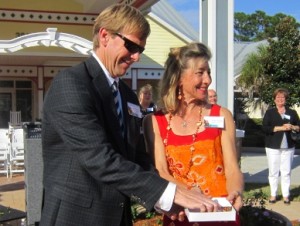 Rob Perers and Susan Vallette of the Health First Foundation release butterflies into the renovated Bjork Osman Butterfly Garden in Palm Bay.