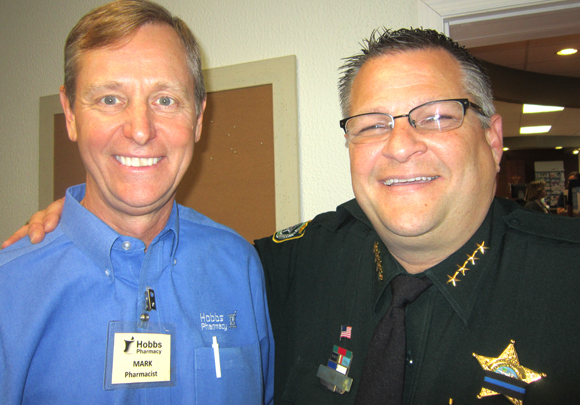 Sheriff Wayne Ivey congratulates Mark Hobbs on the 50th Anniversary of the business. (Cyndi Byars image)