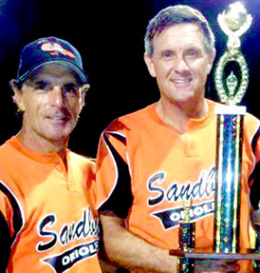 ACTIVE LIVING: Bill Flutie, above right, stays active playing baseball with his brother Doug, left, on a local team. When Bill recently blew out his knee playing baseball, his primary care physician, Dr. Steve Badolato, referred him to First Choice Medical Group’s Dr. Tony Lombardo. (Image for Space Coast medicine & Active Living)