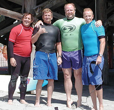 SURFIN’ BUDS: (left to right) Jack Kirschenbaum, Bob Freeman, Harry Greenfield and Dr. Don Stewart during the Doctors Lawyers Weekend Warriors surf festival held at the Cocoa Beach Pier. (Image Courtesy of Dan Mahoney)