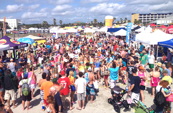 A Distinguished Easter Surfing Championship trophy will be presented to all winners (1st – 4th). Spectators are learning surfing and skim boarding via on site clinics, participating in celebrity signings, attending the Easter egg hunt, enjoying evening entertainment with movies, bands, parties and experienced a Sunrise Service this morning. (SpaceCoastDaily.com image)