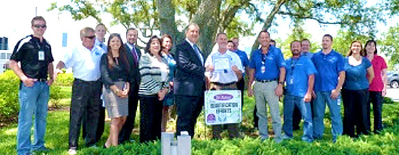 Attending the "We Noticed" presentation were Tony Sasso, KBB Executive Director; Bill Nichols, KBB South Chapter President; Melbourne Mayor Kathy Meehan; KBB Board and South Chapter members; a Melbourne Regional Chamber of Commerce official; Embraer's Managing Director for Melbourne Operations Phil Krull; other Embraer staff; along with the owner of Robertson's Lawns & Landscaping, that installed much of the landscaping. (Melbourne Chamber image)