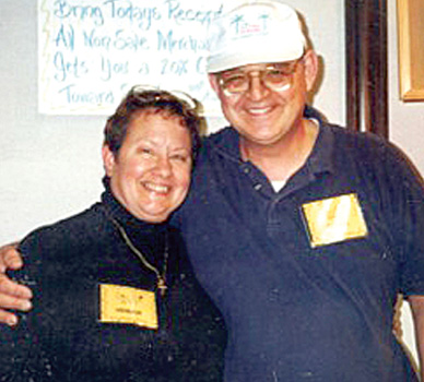 IN THIS “BEFORE” photo, Mary Ramba’s husband Gene has been a staunch supporter of her running throughout the years and often volunteers at races. Walking around the track at Merritt Island High School, Ramba encountered a man who asked her if she would like to run a marathon for charity. The fellow was Jack Kenworthy.