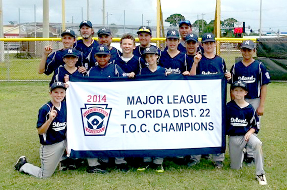 Merritt Island Little League poses with the Championship Banner