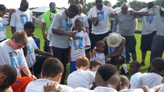 Eight-year-old Joshua Brown opens camp with a prayer. 