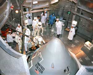 The Apollo 1 crew, Gus Grissom, Ed White and Roger Chaffee, enter their spacecraft for a test in the O&C altitude chamber on October 18, 1966.