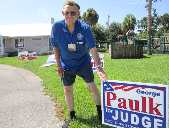 Bob Johnston of Melbourne Beach shows his support for Circuit Court Judicial candidate George Paulk at Melbourne Beach Precinct 305.