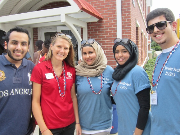 LEFT TO RIGHT:  Florida Tech students Khalid Alanazi, Tori Leslie/ISSO Program Coordinator, Khloud Shuquair/ISSO President, Lina Alrashdi and Abdullah Kurdi learn about Panther football. (Cyndi Byars image)