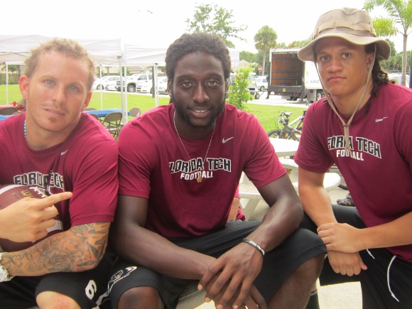 Panther Football team players, from left to right, wide receiver Tyler Bass, wide receiver Xavier Milton and defensive back Jeffrey Thomas greeted international students at Florida Tech's recent "Football 101" Welcome Event. (Cyndi Byars image)