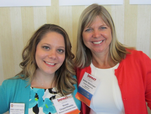 Women's Business Center Operations Coordinator Renee Couperthwaite (left) greets WBC Board Member Debbie Steininger (right) as the Summit gets underway.