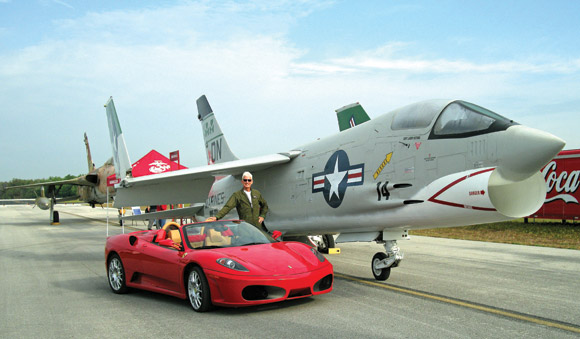 A Ferrari enthusiast, Larry Sietsma is an amateur race car driver, driving the bright red “sculpture on wheels” in gentleman racing events at courses such as Sebring. As a Marine fighter pilot in Vietnam, he flew the fierce F-8 Crusader jet fighter. (Image for SpaceCoastDaily.com)