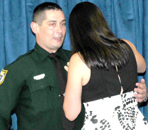 Robert Smith graduated from the Law Enforcement Academy at Eastern, and on Friday, realized his dream when he was sworn-in as a Deputy Sheriff with the Brevard County Sheriff's Office. "Watching his wife pin his badge on him was one of the most touching things I have ever seen," said Brevard County Sheriff Wayne Ivey. (Image for SpaceCoastDaily.com)