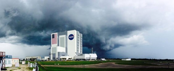 This wide-angle view from the Press Site shows dark rain clouds as they moved toward the Vehicle Assembly Building and Launch Control Center earlier today, Aug. 11, 2014. Thunderstorms have been almost a daily occurrence along the Space Coast during the summer of 2014. (NASA.gov image)