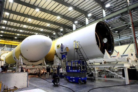 In the Horizontal Integration Facility at Cape Canaveral Air Force Station, two core elements of a Delta IV Heavy rocket are brought together in preparation for Exploration Flight Test-1. (NASA.gov image)