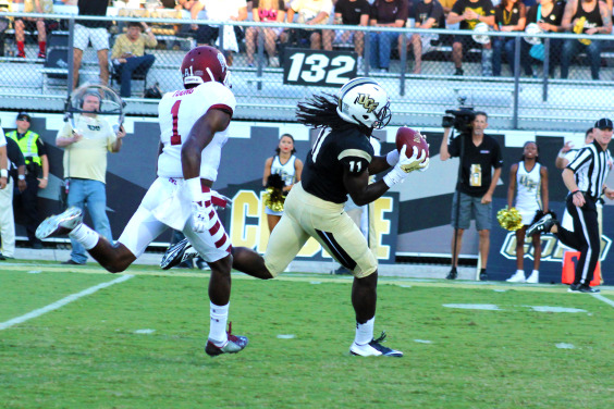 Breshad Perriman, above, came through, not once but twice, for UCF on its next drive, first hauling in a 19-yard reception on third-and-14. Holman then found the receiver streaking down field for a 54-yard touchdown, much to the delight of the crammed student section waiting for him in the south end zone. With 10 minutes remaining in the half, the Knights claimed a 24-7 edge. (Rhett Lighthall)