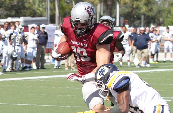 Florida Tech's Gabe Hughes climbs over a Mississippi College defender for a touchdown in the Panthers' 44-9 Homecoming victory Saturday. (Ryan Seeloff image)