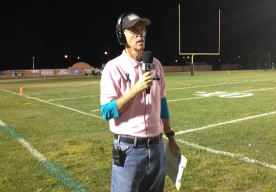 Friday Night Locker Room's Steve Wilson broadcasting from the sidelines at Cocoa Stadium. 