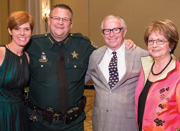 Brevard County Sheriff Wayne Ivey (from left) and his wife, Susan, served as guest auctioneers at Health First Foundation's annual Grape Escape event, which was co-chaired by Pam Gatto, owner of Gatto’s Tires and Auto Service, and John Gallo of Raymond James and Associates. (Image for SpaceCoastDaily.com)