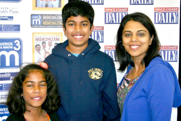 Contestents Priya Gutta, Sajan Gutta, and their mother, Dr. Anita Saluja, at Space Coast Medicine & Active Living magazine's first annual Dwight E. Jones Medical Terminology Spelling Bee held at the Melbourne Rialto Hilton on Saturday. (SpaceCoastDaily.com image)