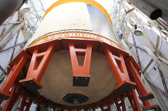 18-foot-diameter (5.5-meter) composite cryotank is lowered into a structural test stand at Marshall Space Flight Center. (NASA.gov image)