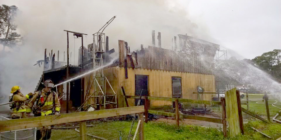 A structure fire in Canaveral Groves was reported by Brevard County Fire Rescue with a heavily involved second floor and multiple rounds of ammunition going off as a result of the intense heat and flames. (BCFR image)