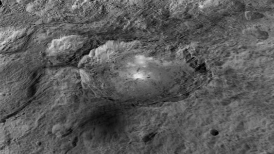 The intriguing brightest spots on Ceres lie in a crater named Occator, which is about 60 miles (90 kilometers) across and 2 miles (4 kilometers) deep. (NASA Image)