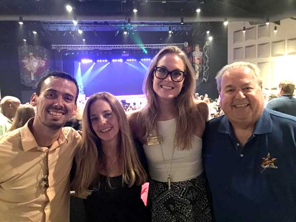 Toño Gonzalez, Alison Malone, Veronika Westermark and T McCreary enjoy the opening performance of Up With People at Holy Trinity Episcopal Academy on Friday night. (SpaceCoastDaily.com image)