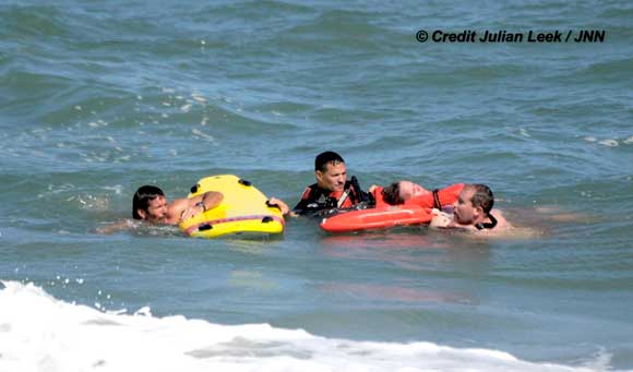 Brevard County Fire Rescue, along with Ocean Rescue and the Brevard County Sheriff's Office Aviation Unit, rescued a swimmer in distress on Saturday about 12:15 p.m. near Indialantic. (Image courtesy of Julian Leek)