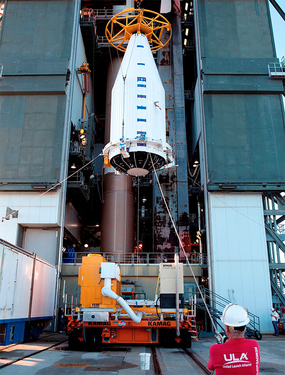 A crane lifts the Cygnus spacecraft, fitted inside a payload fairing, to the Vertical Integration Facility at Space Launch Complex 41 so the spacecraft can be bolted to the top of the waiting United Launch Alliance Atlas V rocket. Built by Orbital ATK, the Cygnus is a cargo-only spacecraft that will take about 7,300 pounds of experiments, equipment and supplies to the International Space Station. (NASA.gov image)