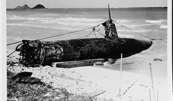 The Japanese midget sub known as Ha-19 is partially hauled onto an Oahu beach during salvage by U.S. forces. It had grounded on Dec. 7, 1941, following attempts to enter Pearl Harbor during the attack. (Department of Defense image)