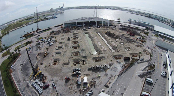 Work continues on the new Cruise Terminal 5 parking garage and upgrades, which include a pier extension of approximately 110 feet to the south and the installation of new fenders and bollards on the existing pier. (Port Canaveral image)
