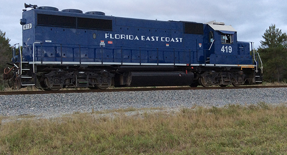 The derailment caused one locomotive to leak diesel while four other rail cars were carrying cargo containers. (SpaceCoastDaily Image)
