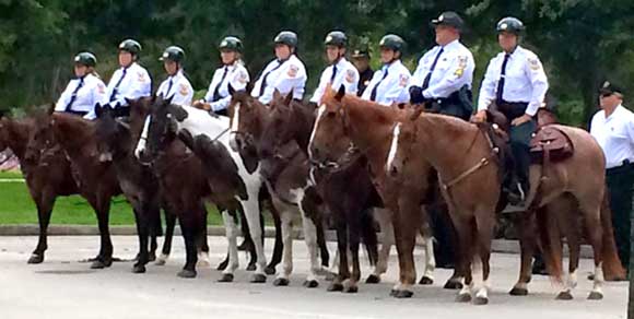 THE BCSO MOUNTED UNIT shown here stood quietly in formation for over 90 minutes in tribute to fallen law enforcement officers at the 2015 Law Enforcement Memorial Service held at the American Police Hall of Fame in Titusville in May.